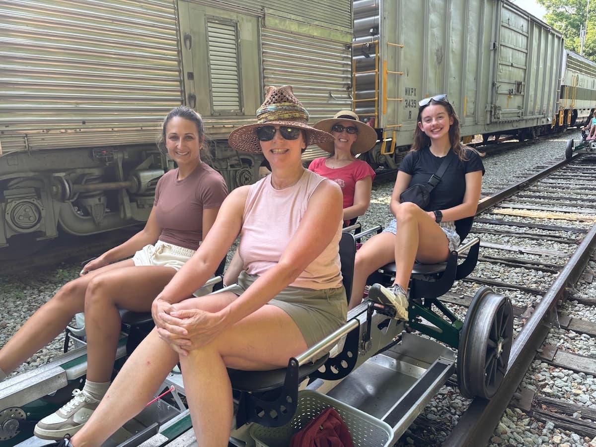 View of riders sitting on a railbike.